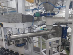 Screw conveyor system in MACTEX's pneumatic conveying setup, designed for efficient material transport in powder handling applications.